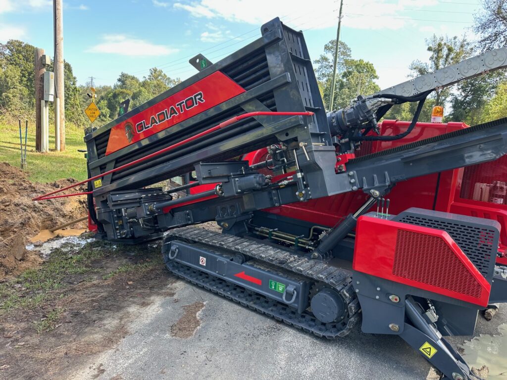 Gladiator horizontal directional drill showing the drill rack and tracked machine frame