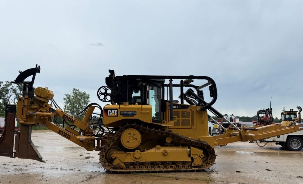 Yellow tracked dozer equipped for heavy utility and right-of-way construction work