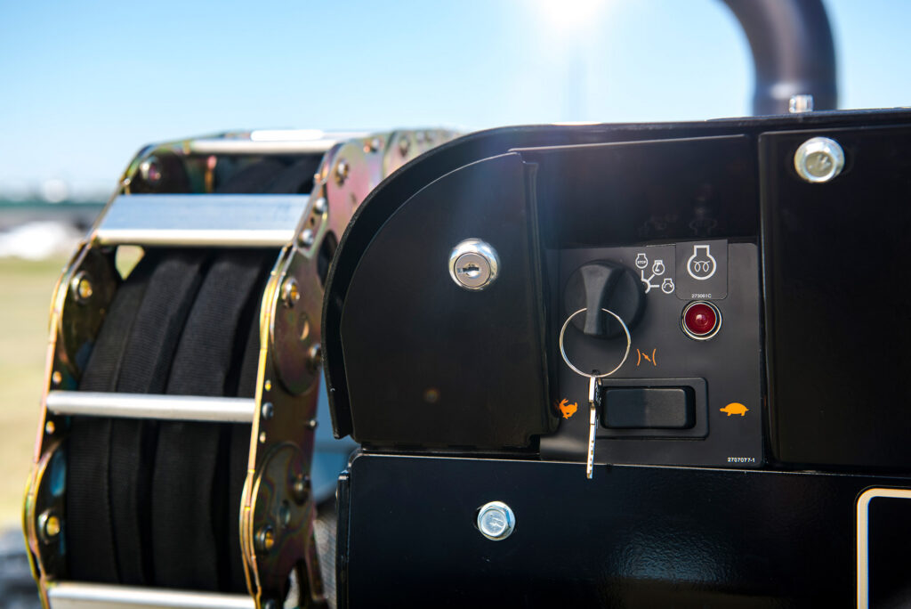 Ditch Witch JT10 rear service panel and exterior machine controls shown in close-up