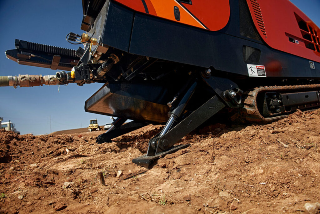 Close-up of the Ditch Witch JT20 drill frame and ground-contact stabilizer assembly