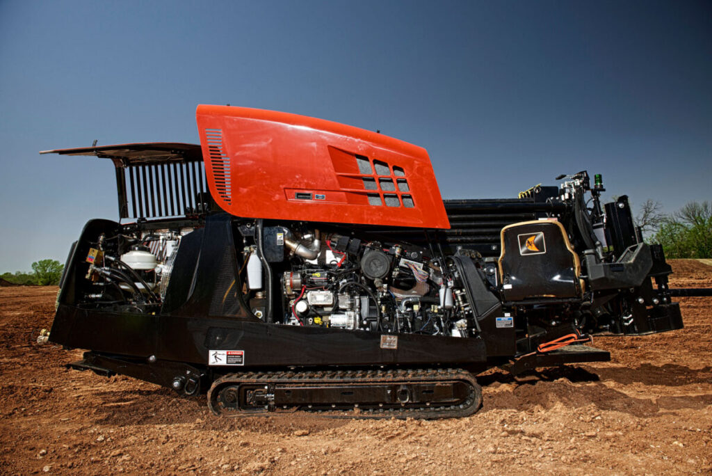 Open Ditch Witch JT20 engine compartment showing internal mechanical components