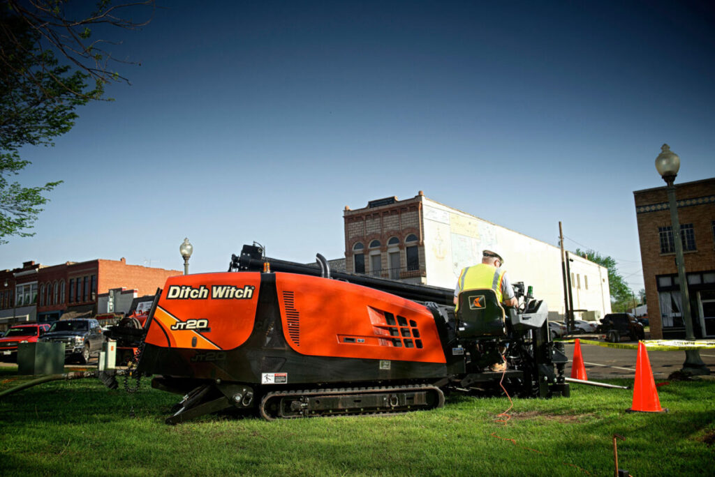 Ditch Witch JT20 directional drill positioned for underground utility work in an urban area