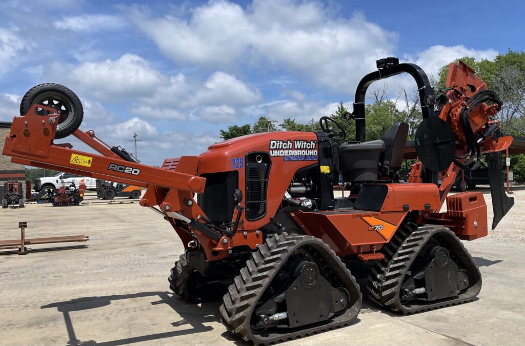 Ditch Witch RT70 Quad utility tractor with plow attachment for underground cable and utility installation