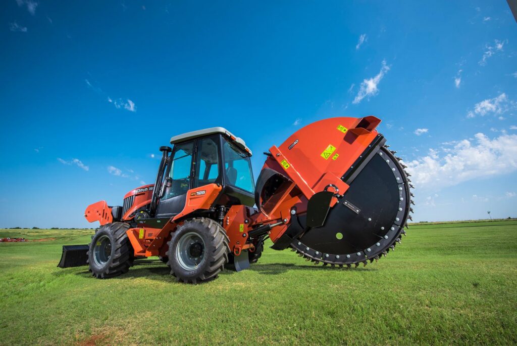 Ditch Witch RT125 tractor equipped with a rock saw attachment for utility trenching